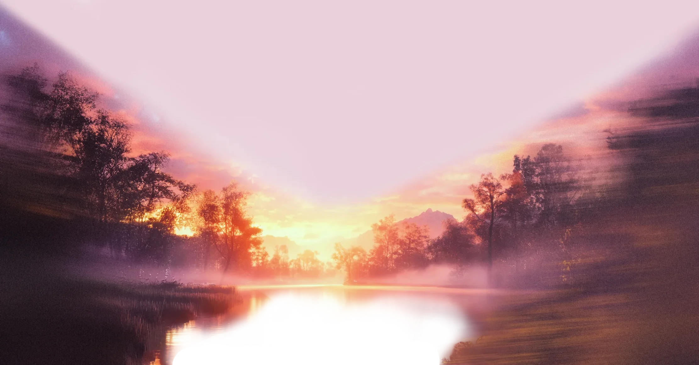 Mist-covered river at sunrise with trees along the banks and a mountain in the background.