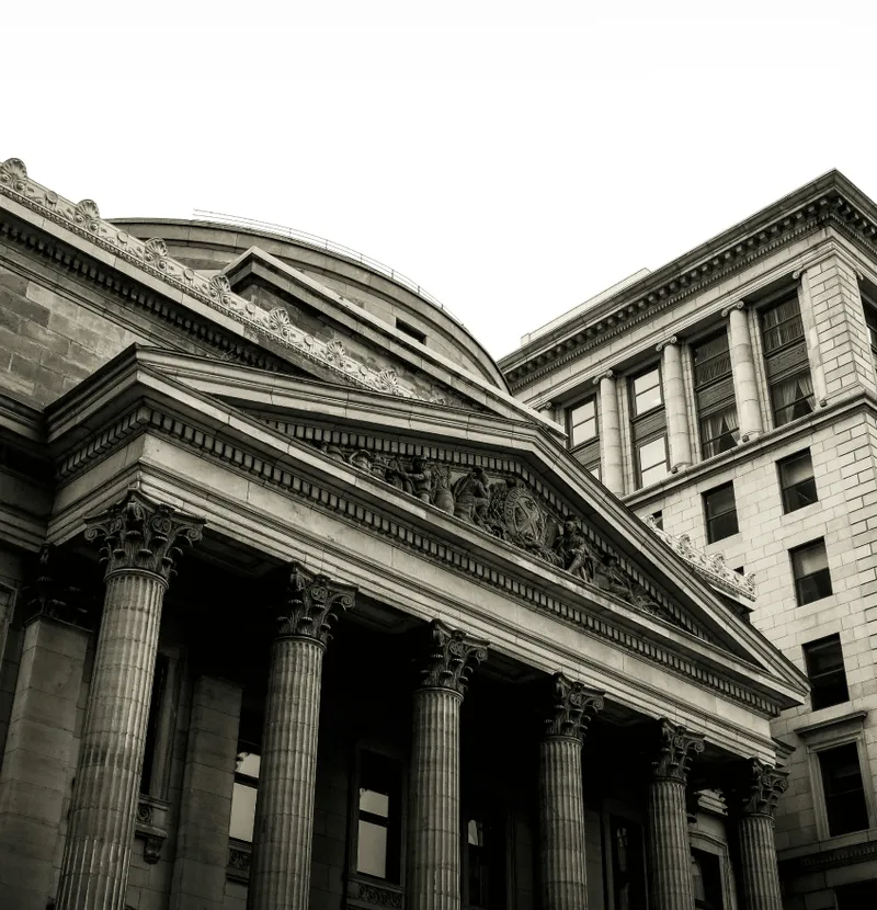 Historic bank building with columns.
