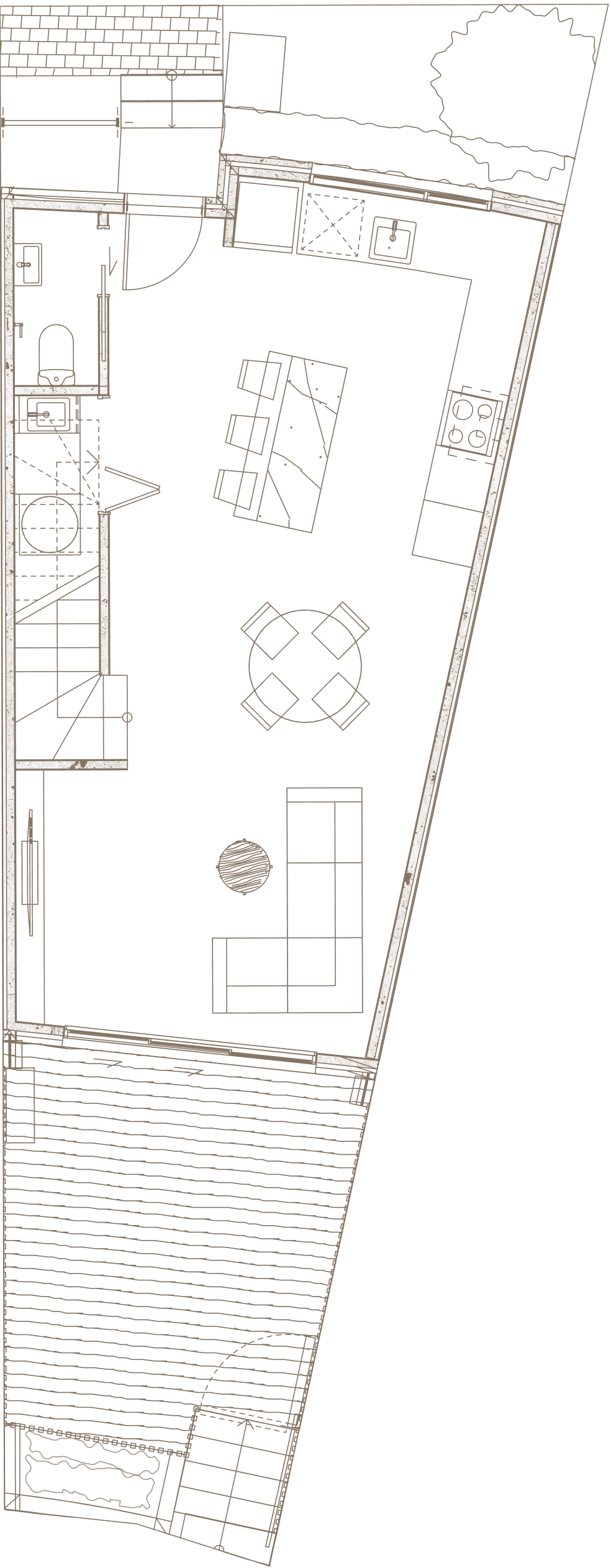 Floor plan of a ground level featuring kitchen with island and dining table, living area, restroom, and outdoor patio.