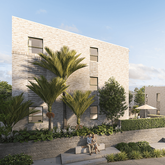 Modern brick building with landscaping, palm trees, and a couple sitting on a stone bench.