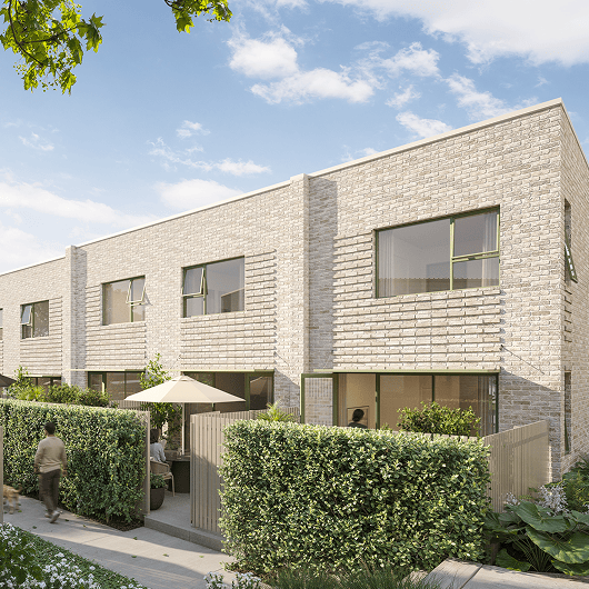 Modern light brick townhouses with green hedges, outdoor patio, and a person walking a dog nearby.