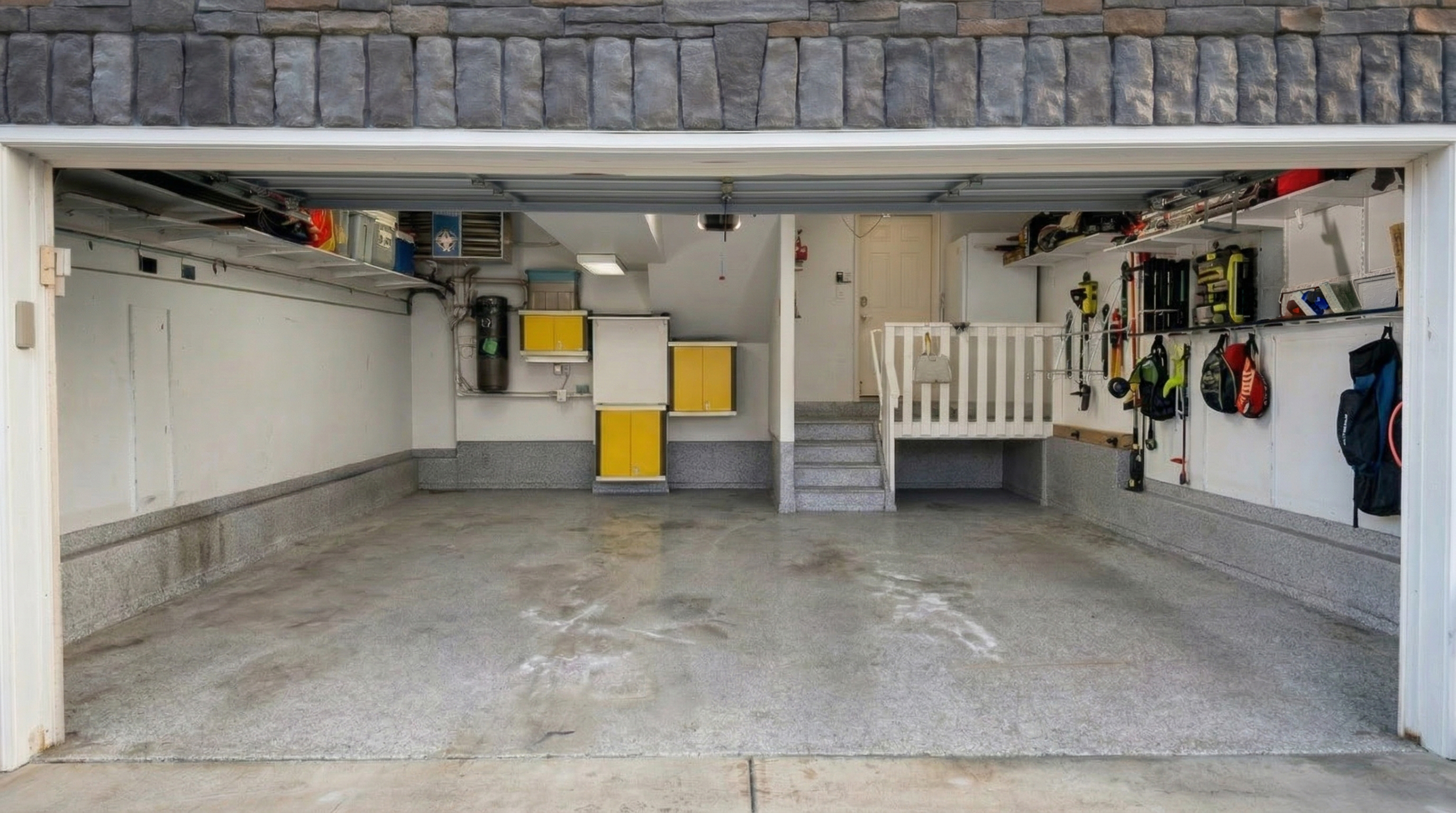 Before: bare concrete garage floor