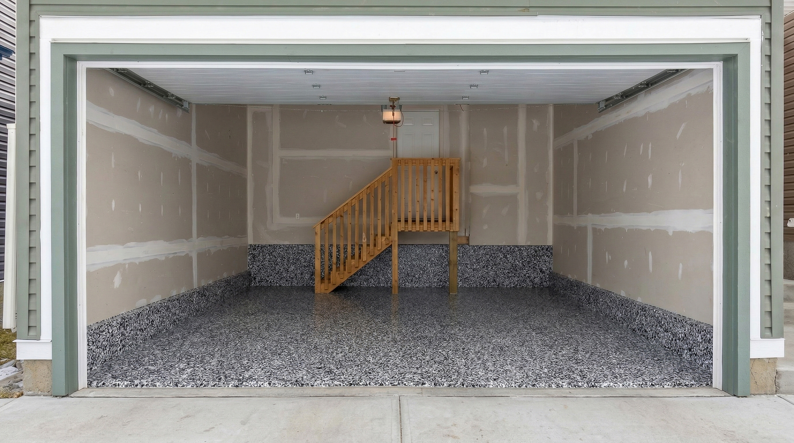 Completed flake epoxy garage floor in Legacy Calgary by Epoxy Floors Canada