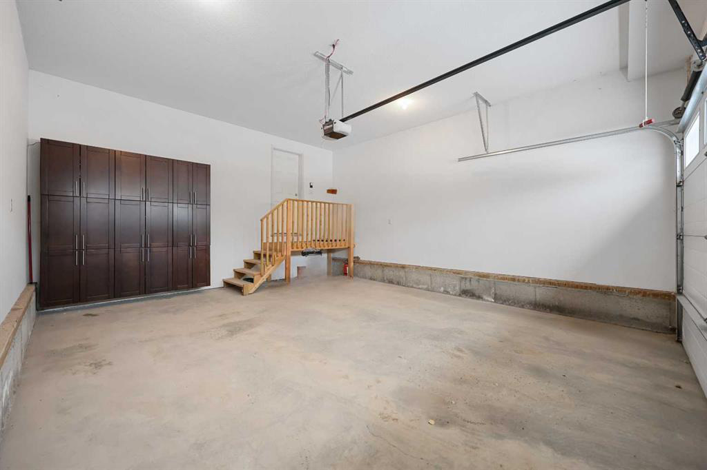 Before: bare concrete garage floor