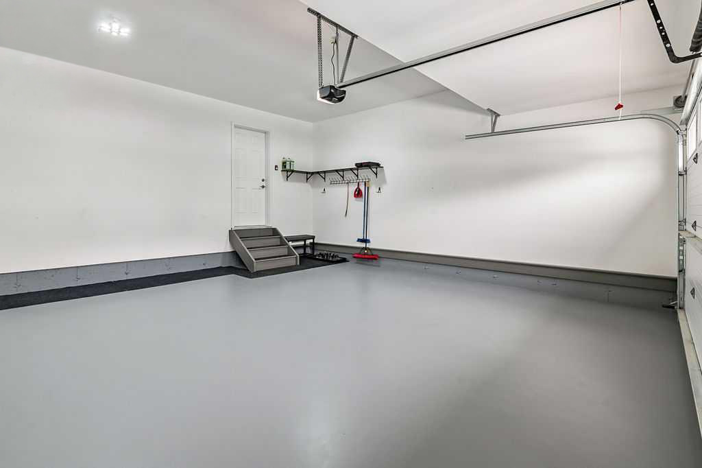 Before: bare concrete garage floor