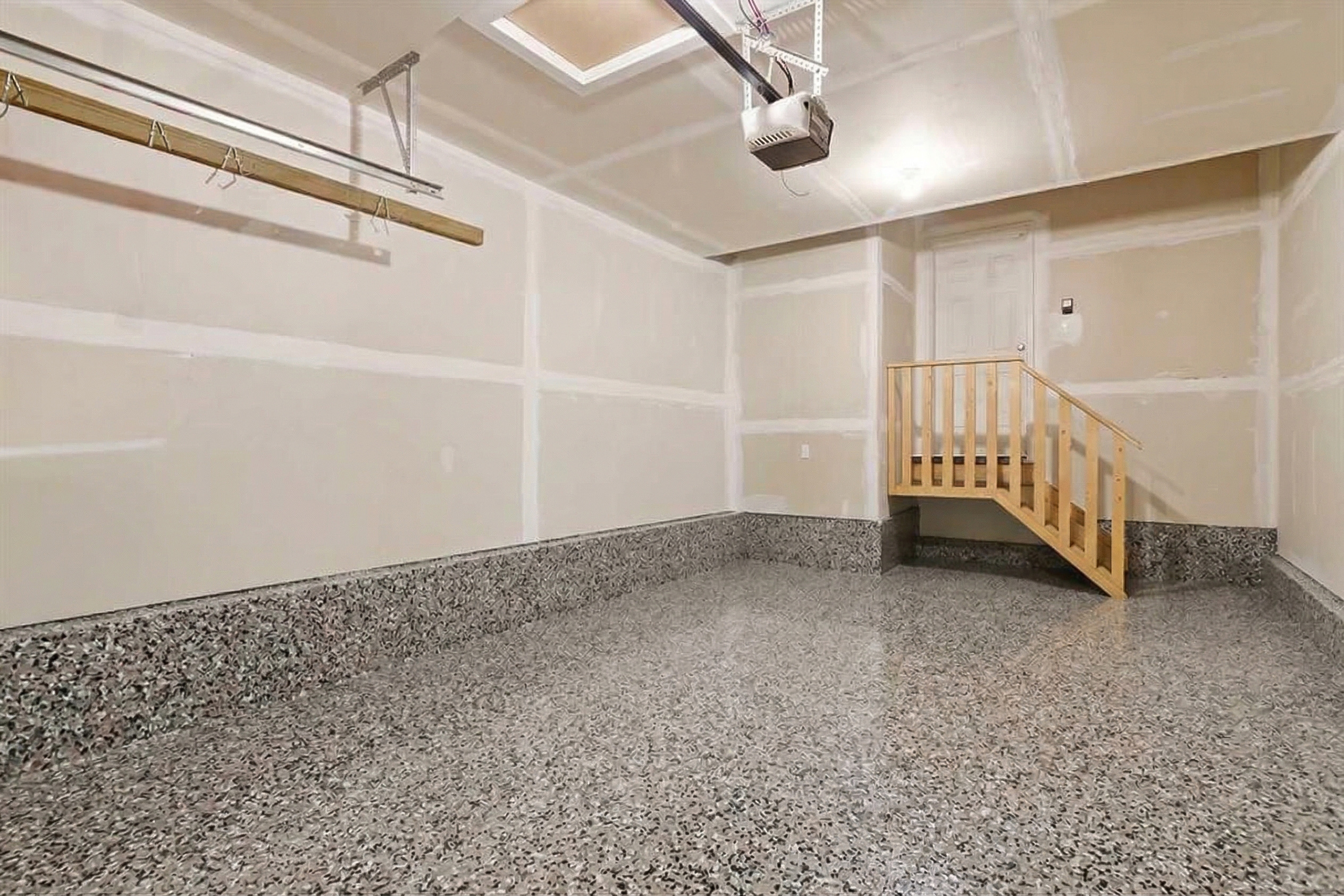 Completed flake epoxy garage floor in Walden Calgary by Epoxy Floors Canada