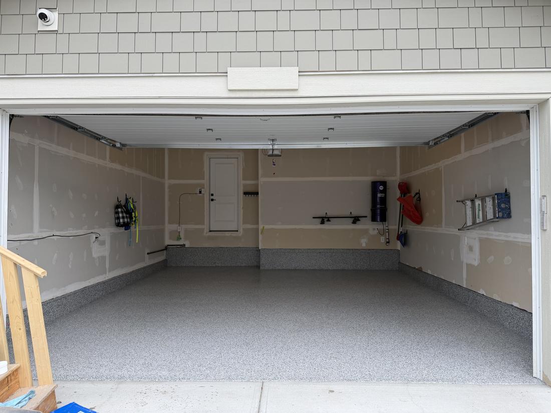 Finished Dovetail full flake epoxy garage floor in Alpine Calgary