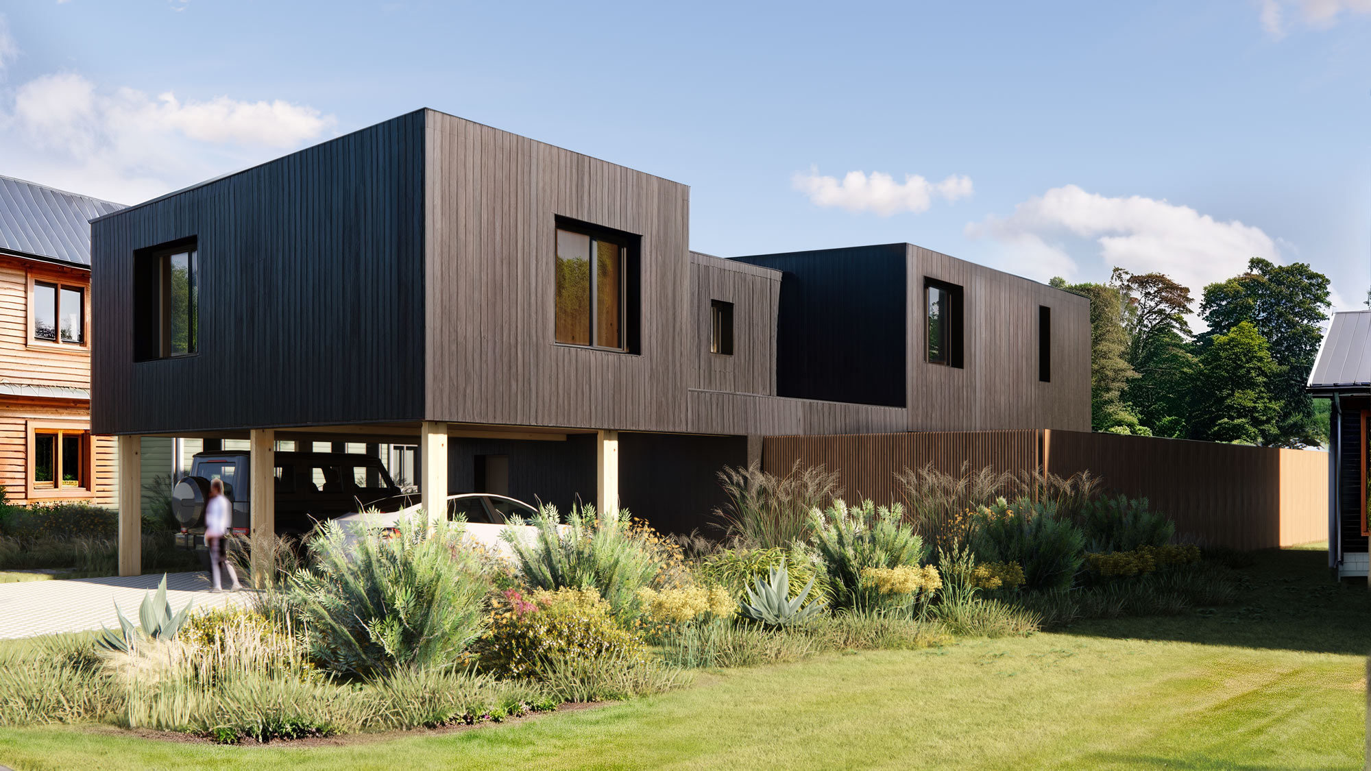 A modern-looking home with wooden siding in a neighborhood full of natural life.