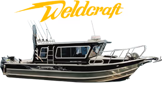 Black and silver Weldcraft fishing boat with cabin and fishing rod holders.