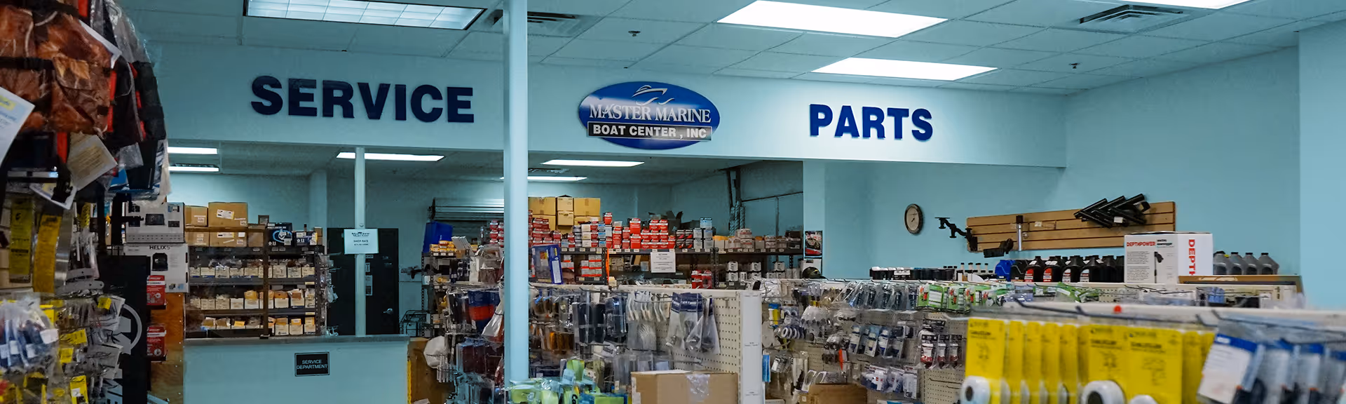 Interior of Master Marine Boat Center parts and service department filled with shelves of marine parts and accessories.