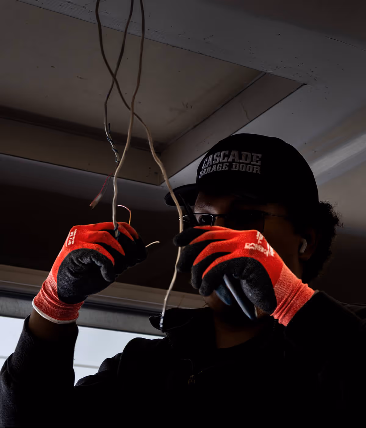 Garage door technician installing an opener
