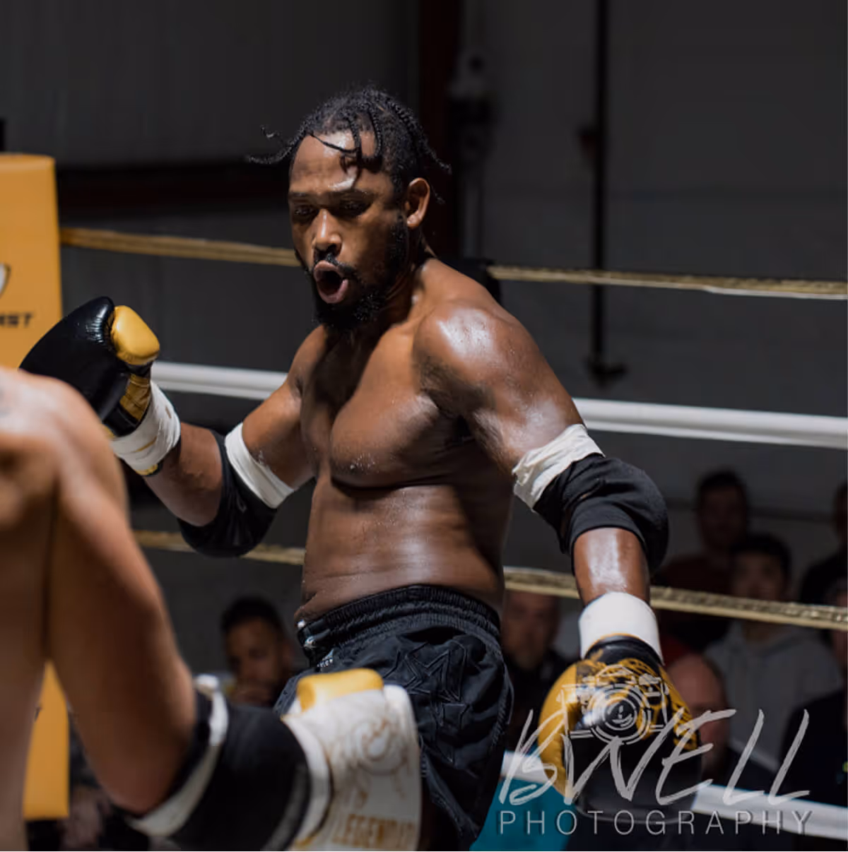 Shawn Saddler fighting in the ring at a Washington state tournement.