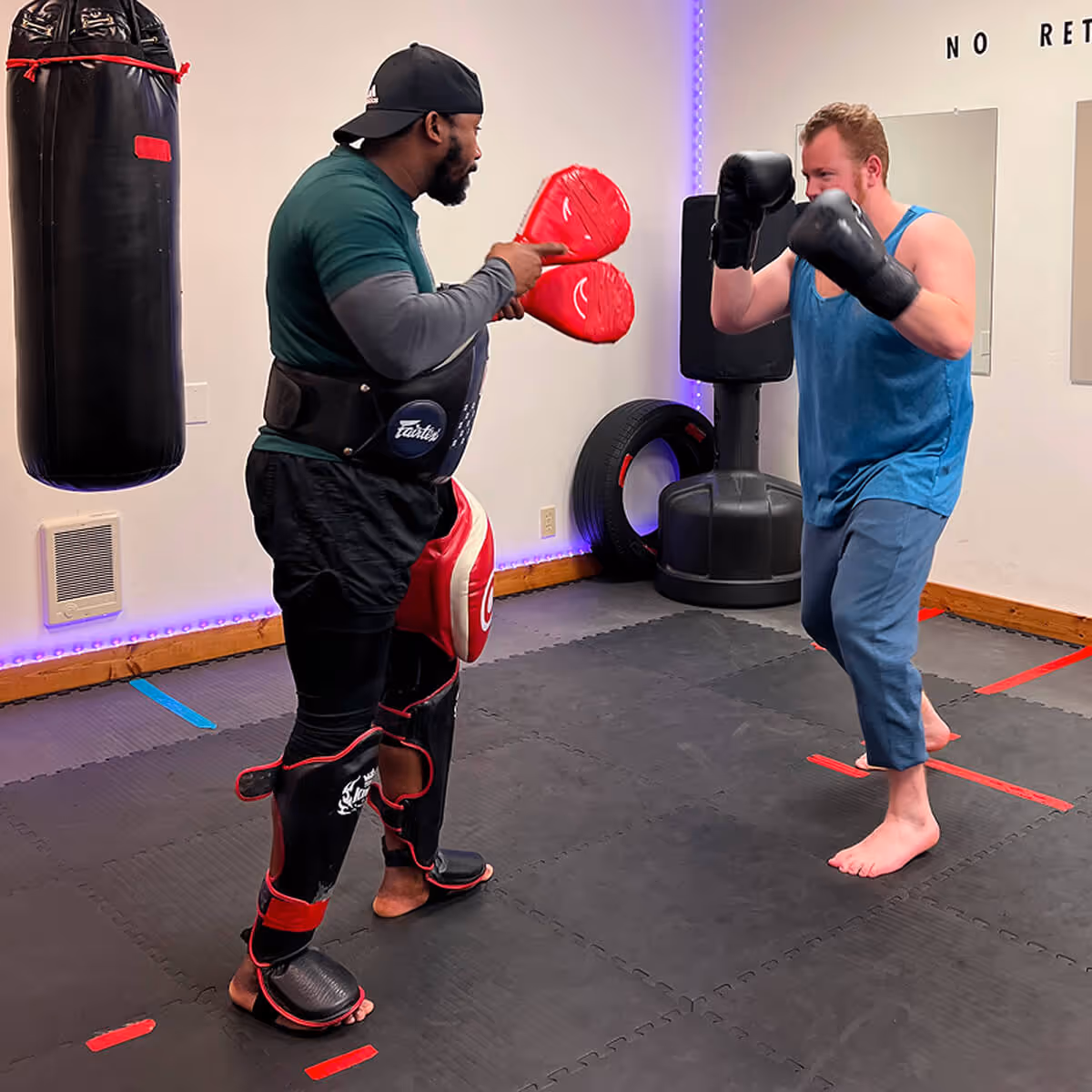 Shawn Saddler from SMPR Fitness training a student.