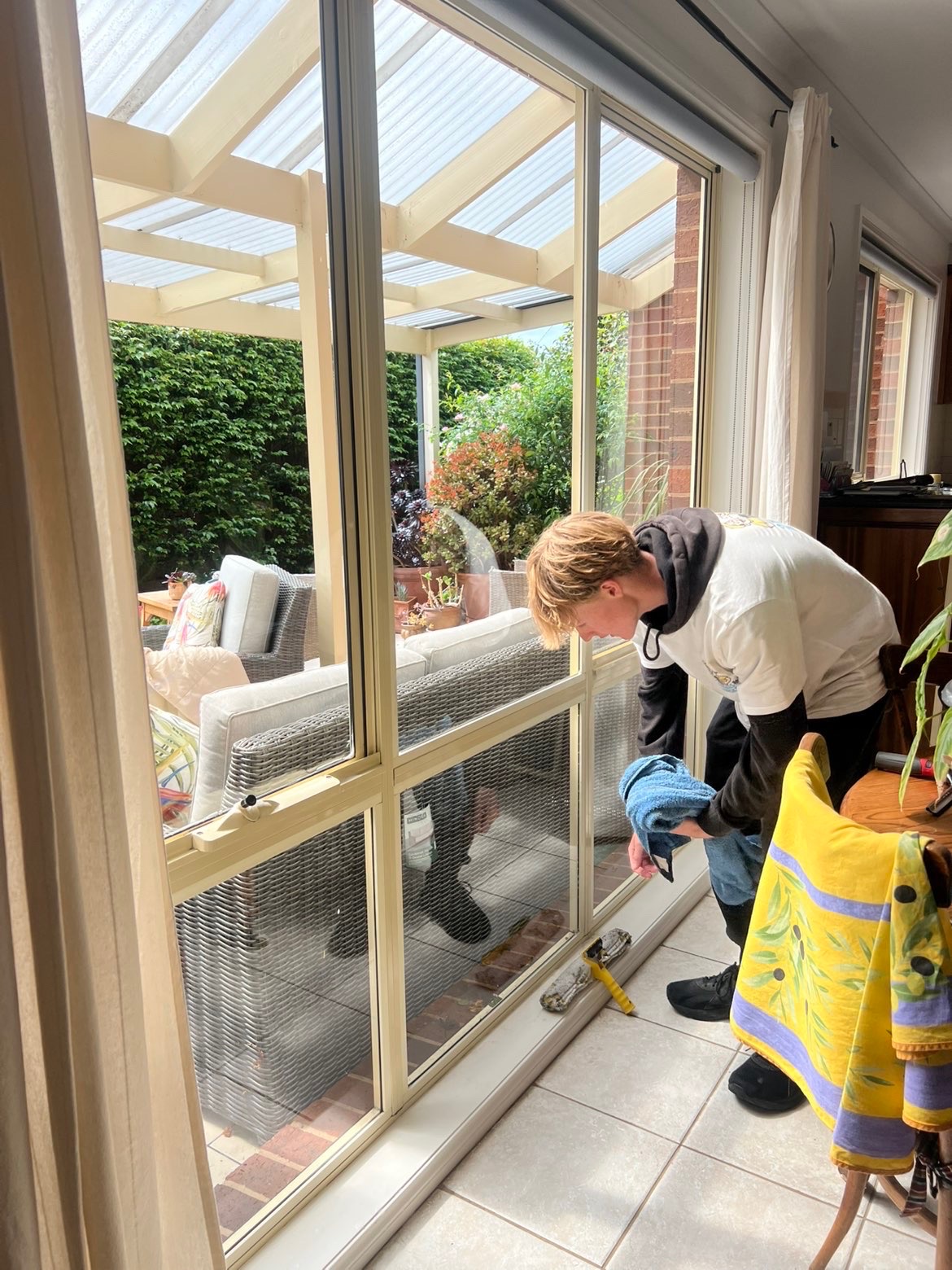 image of plumber fixing a sink