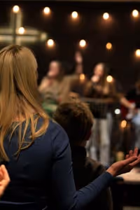 A congregant enjoying worship during a Sunday service at Canberra International Church.