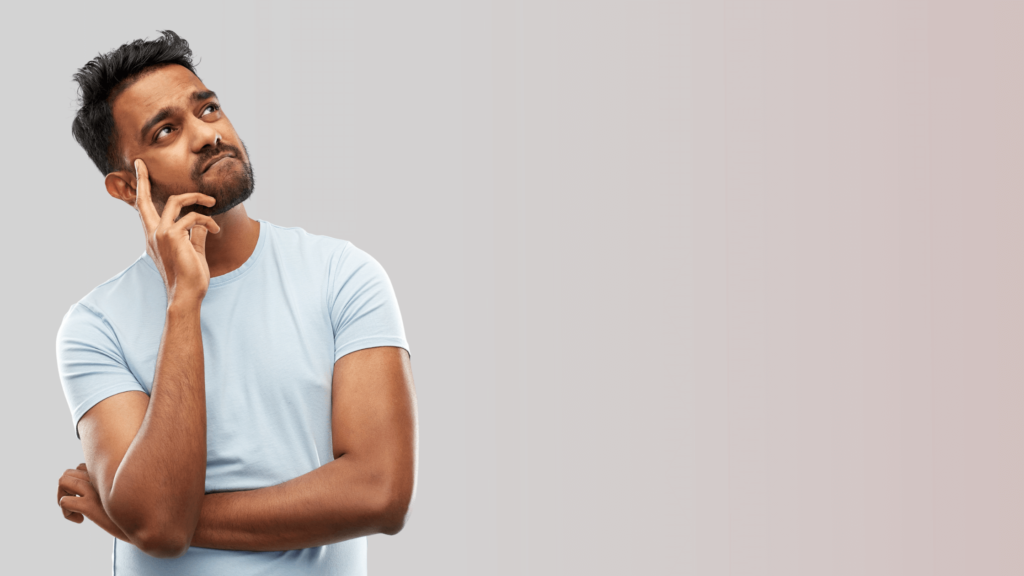 man thinking with his hand on his cheek