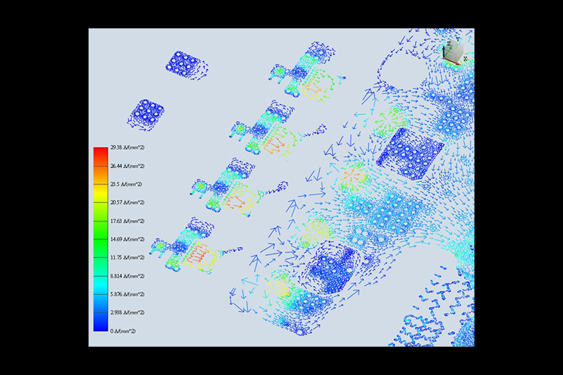 Colorful vector field visualization with arrows showing current distribution intensity across a patterned surface.