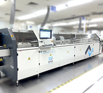 Industrial Ersa wave soldering machine with control panel in a manufacturing facility.