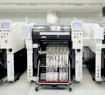 High-speed industrial electronic assembly machine with multiple wire harnesses and digital screens.