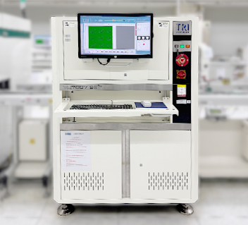 Industrial analyzer with monitor showing green sample image and grey section, keyboard below screen.