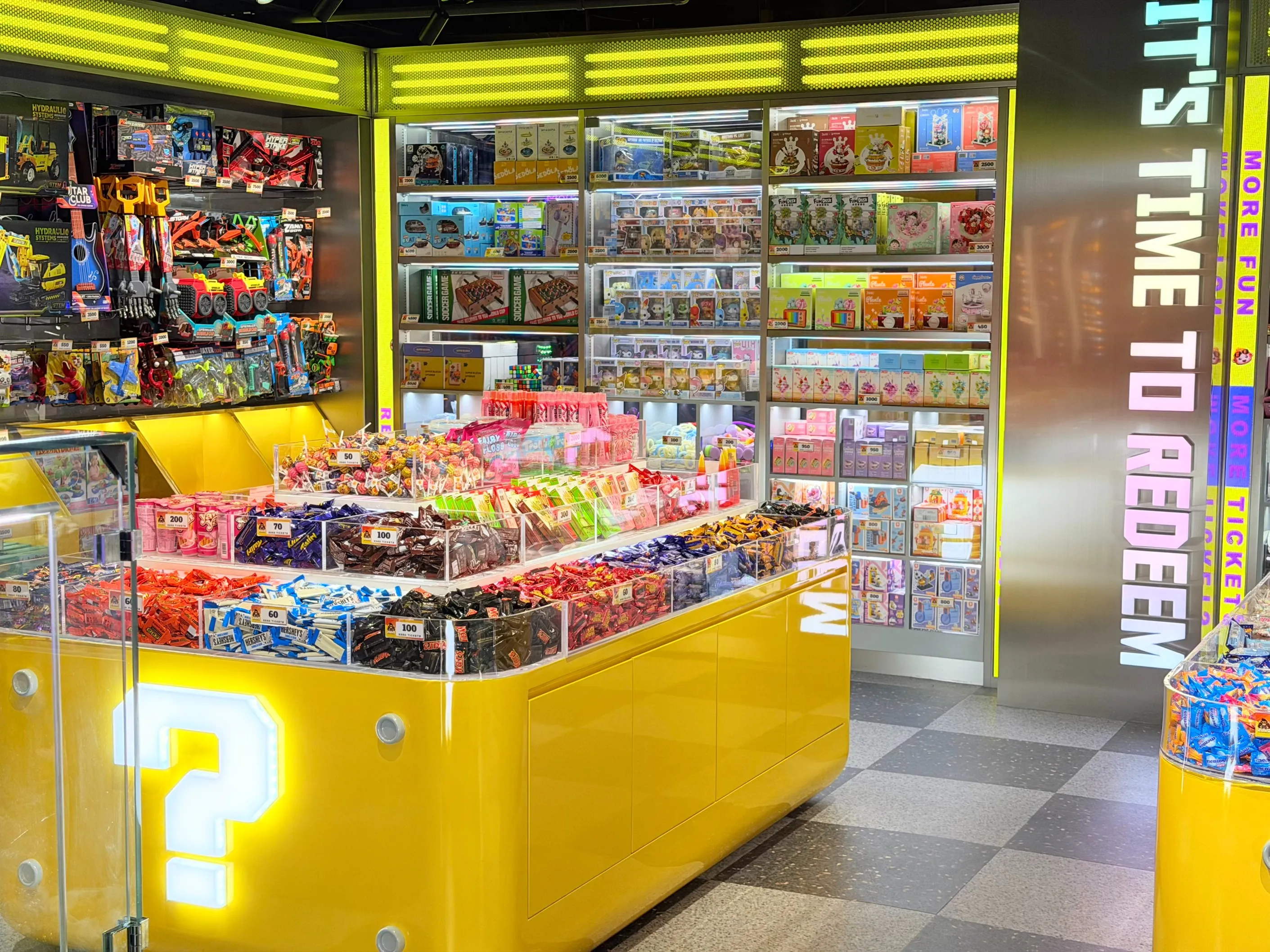 Prize redemption store at KOKO Amusement, with shelves of toys, lollies and ticket prizes
