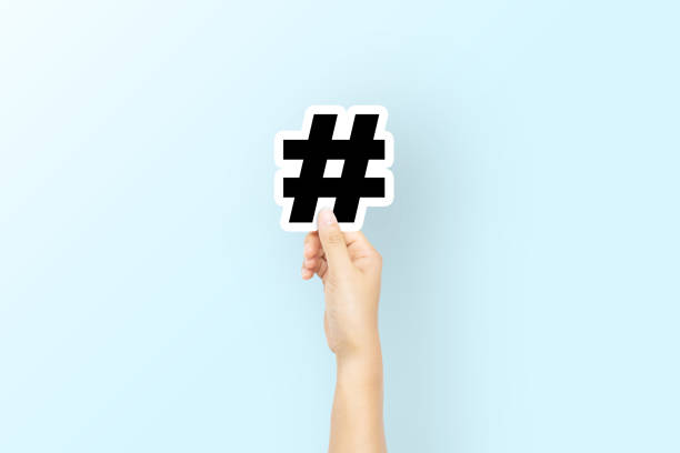 hand holding hashtag cutout