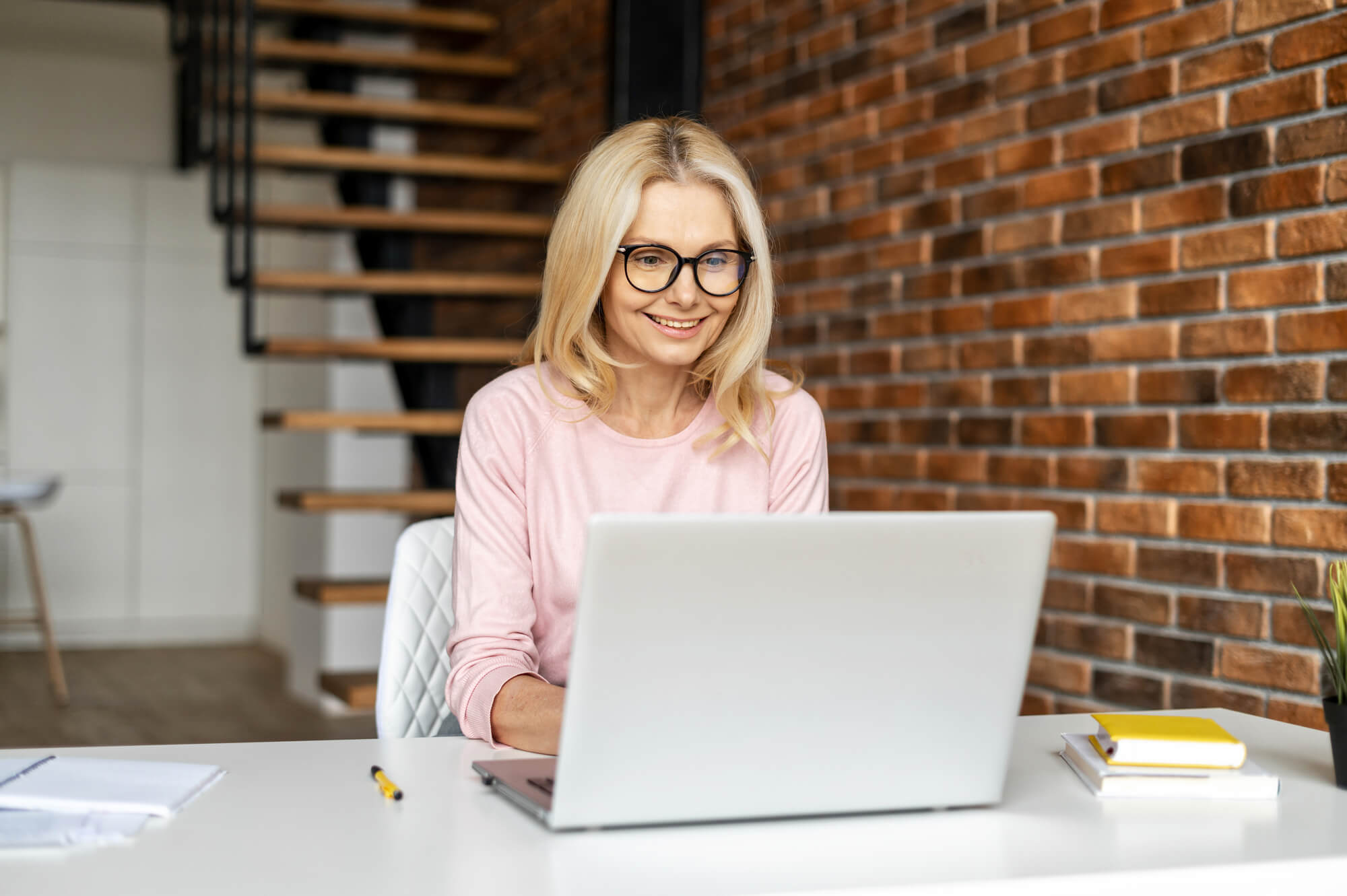 woman looking at laptop intently