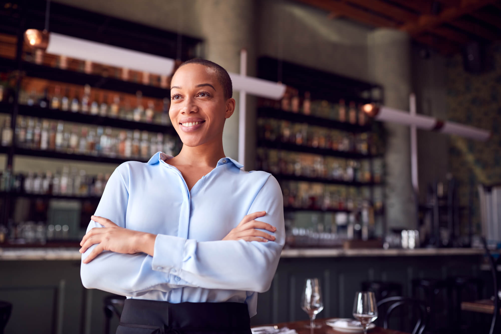 proud female cafe owner posing