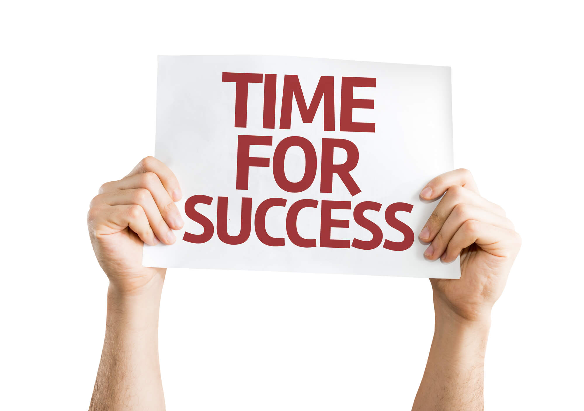 person holding sign that says "time for success"