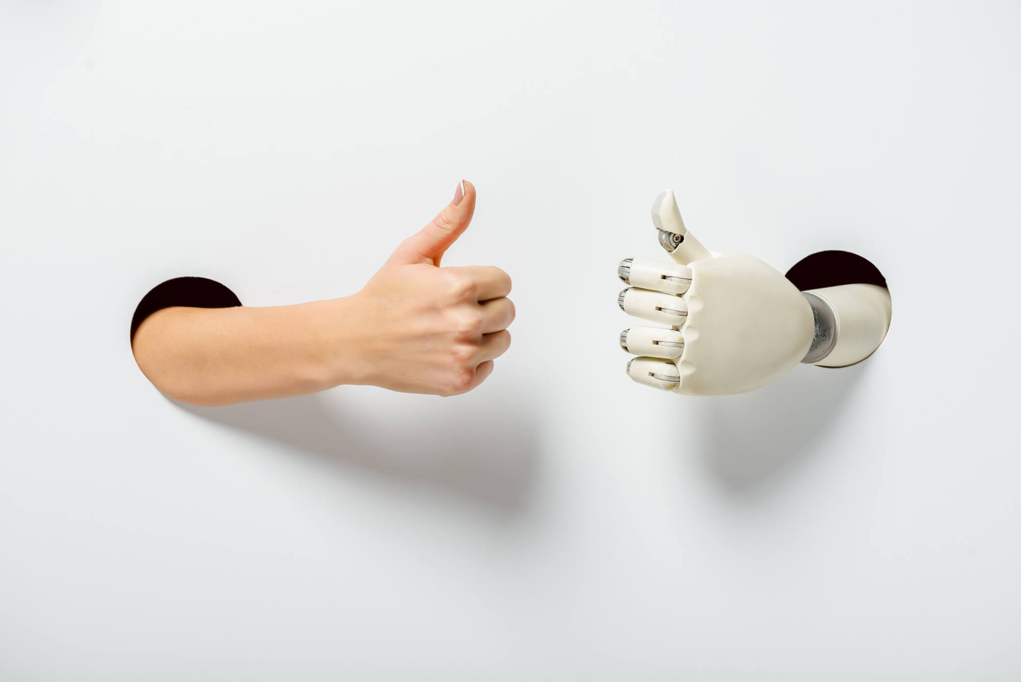 human and bot giving a thumbs up
