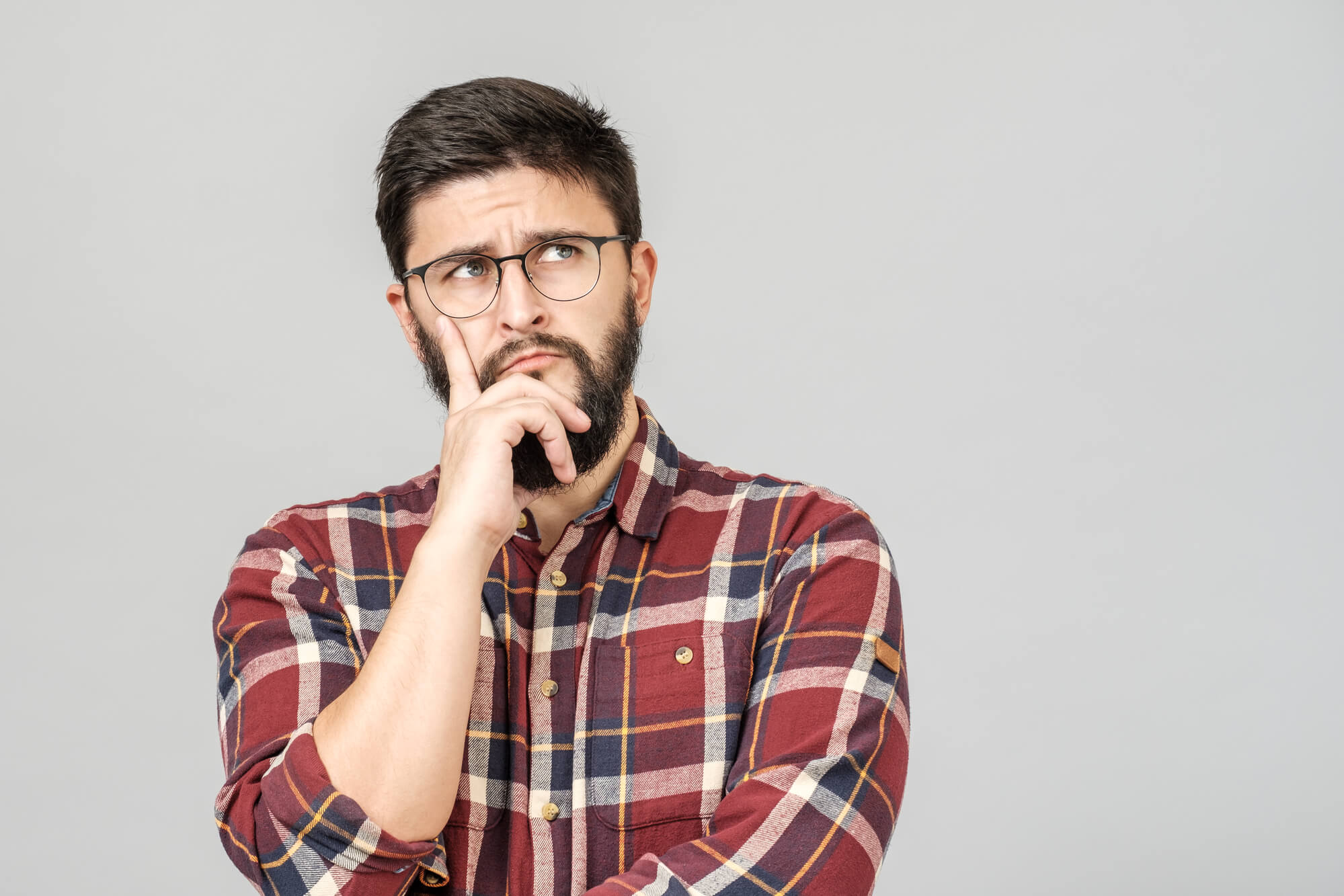 man with eyeglasses wondering