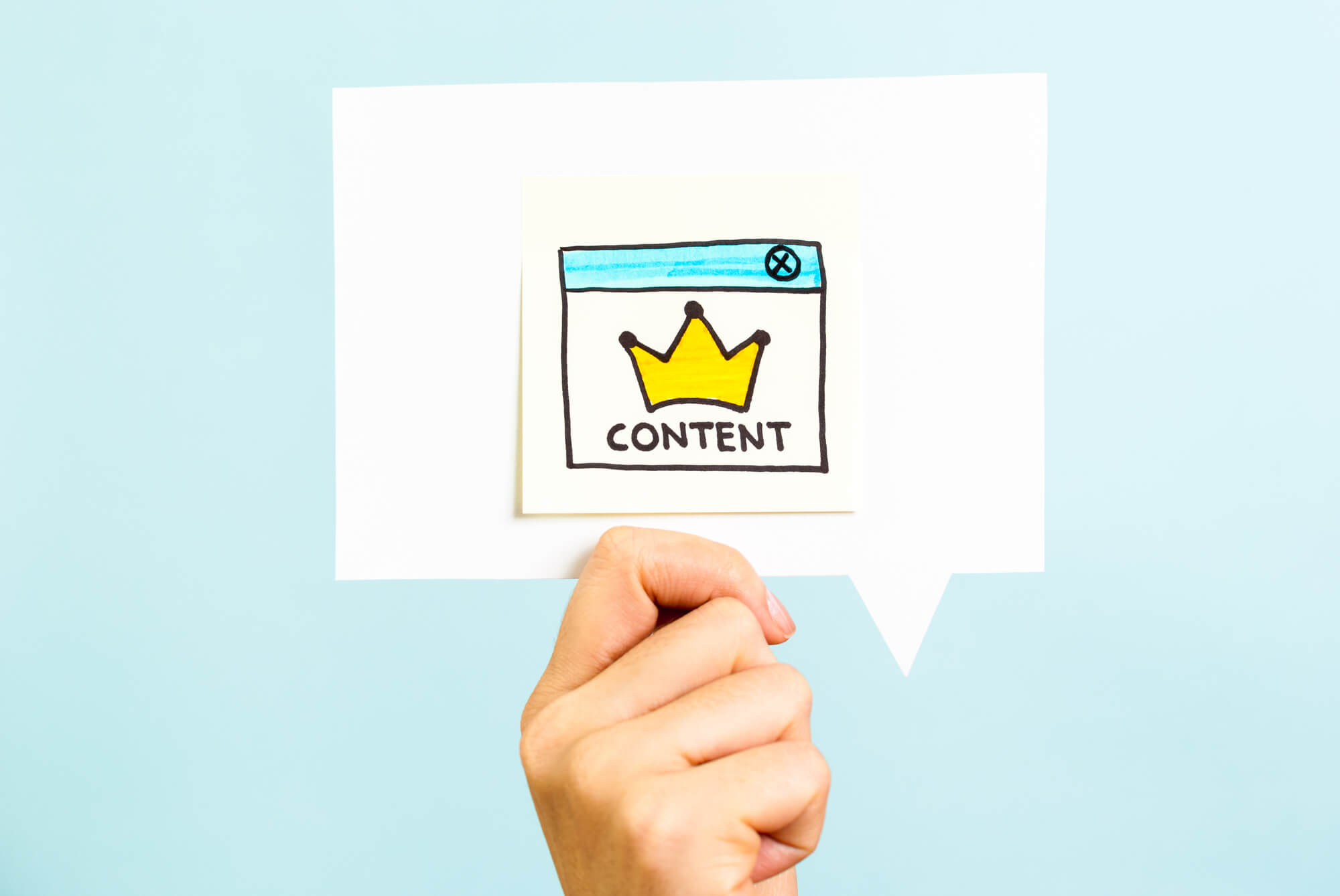 marketer holding note with content is king concept