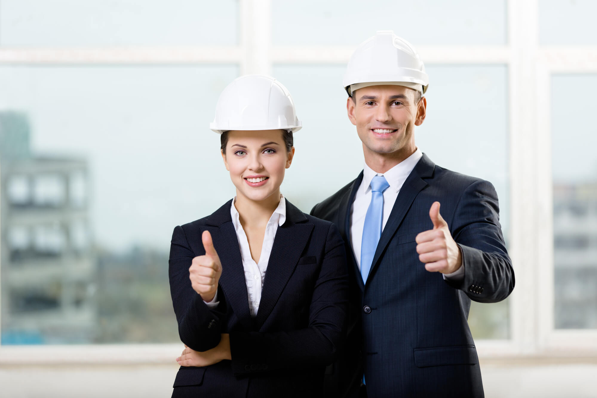 two happy contractors giving thumbs up