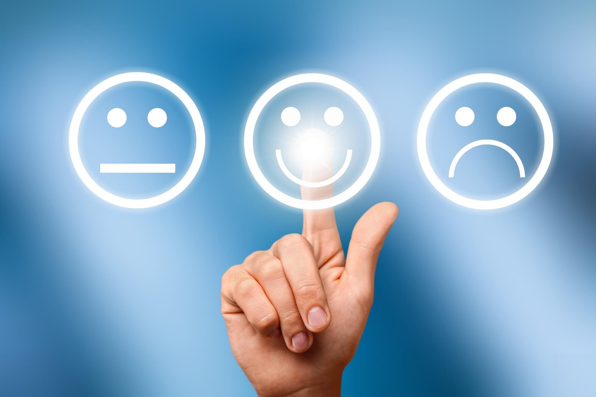 finger pointing at smiling face rating