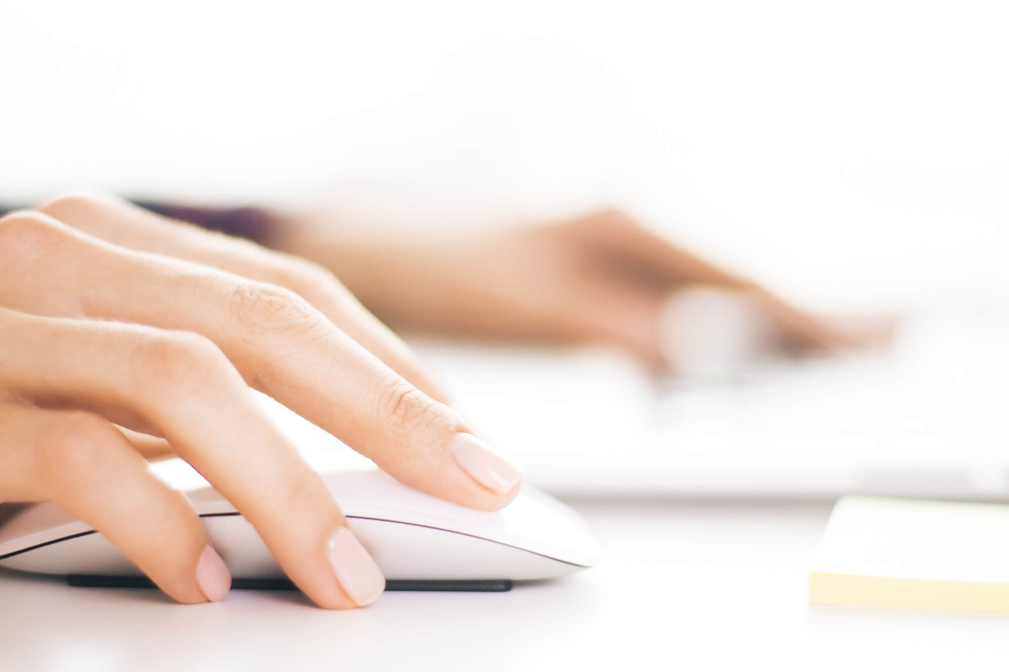 hand clicking on a mouse