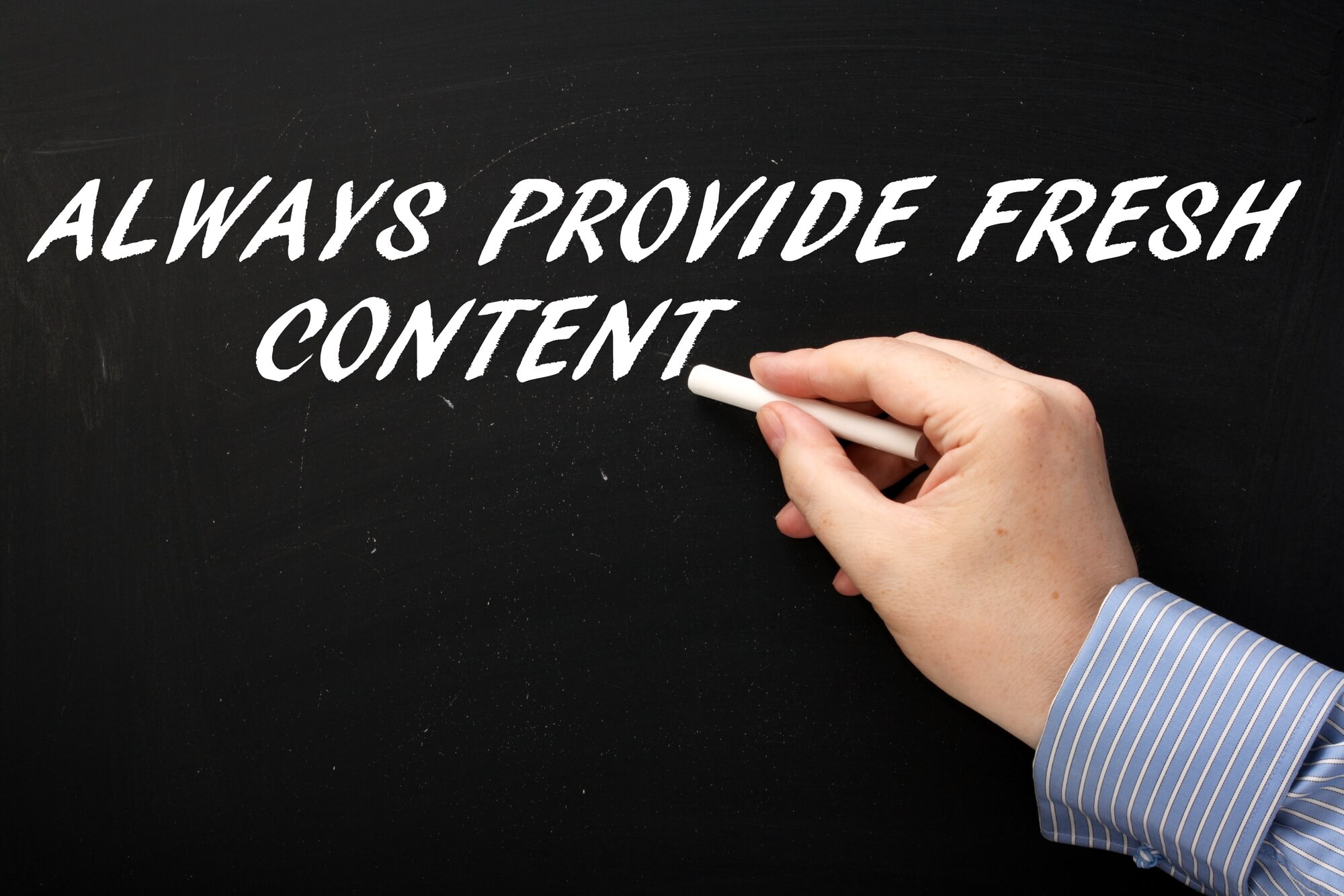 man writing always provide fresh content on chalkboard