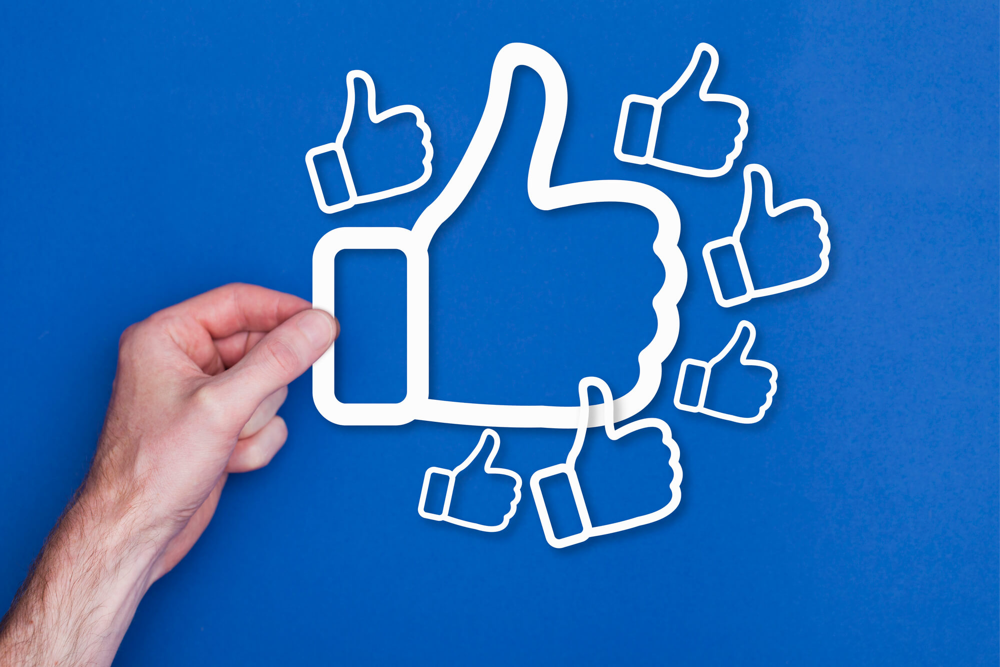 hand holding a big thumbs up sign