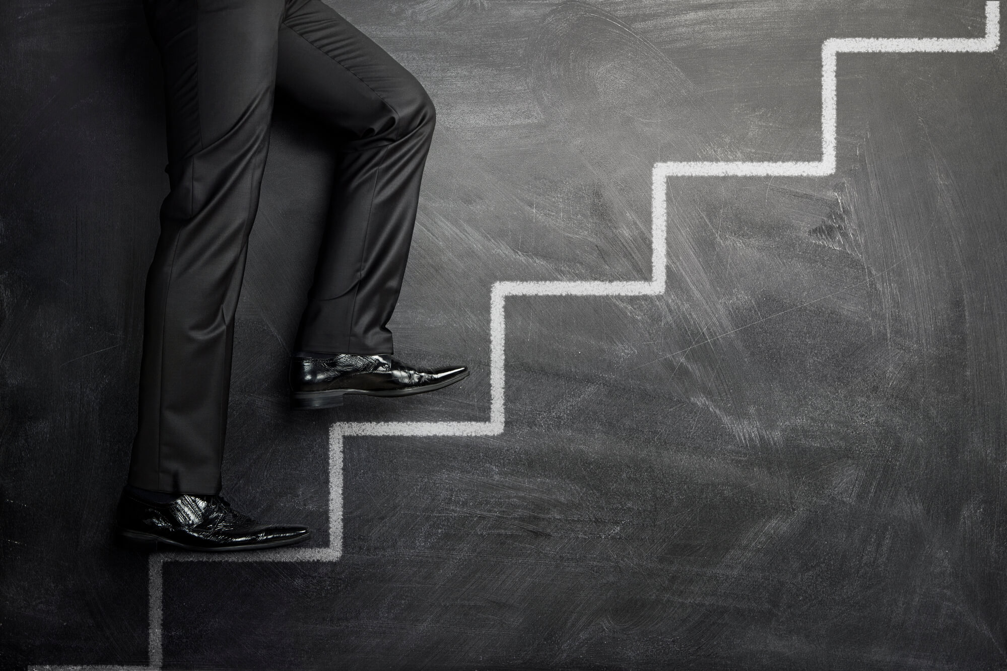 businessman climbing up the stairs