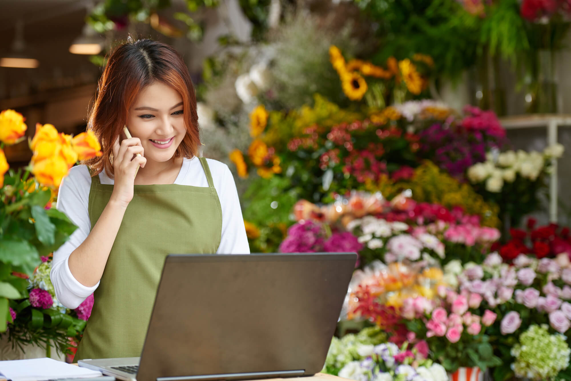 flower shop owner answering a phone call