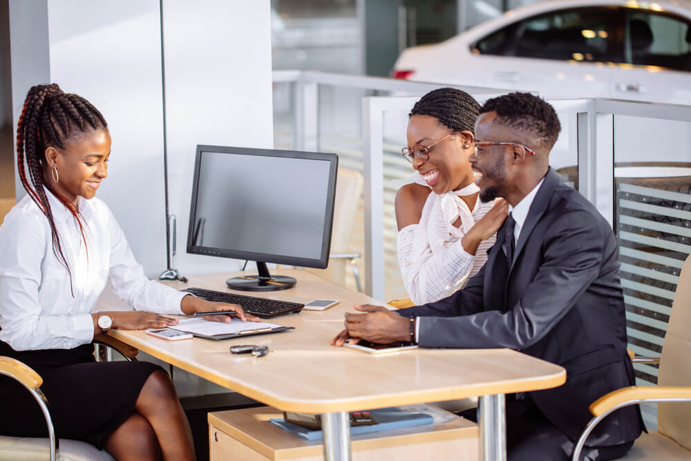 Employee from an SEO company in West Palm Beach  helping customers sign up to services. 