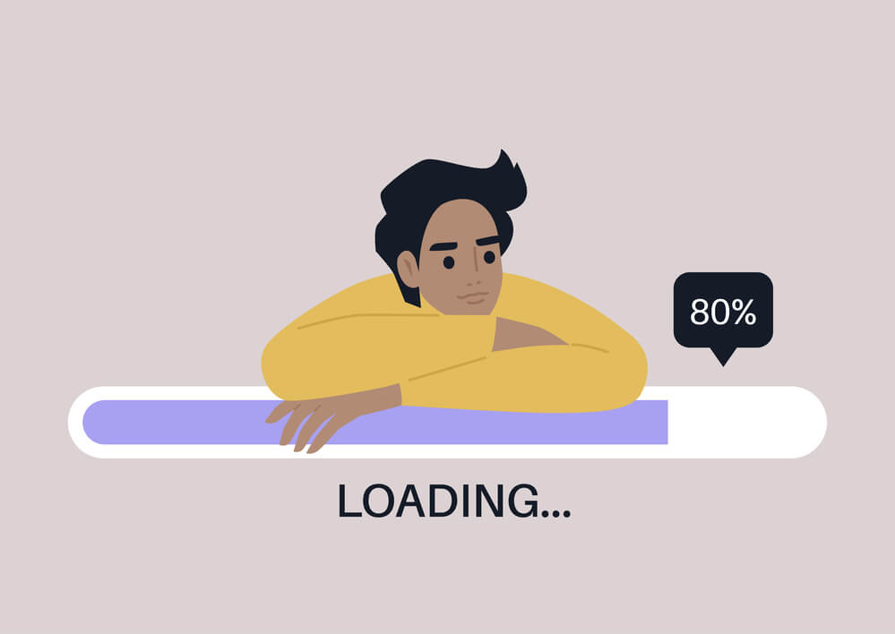 Young male leaning on slow-loading progress bar.