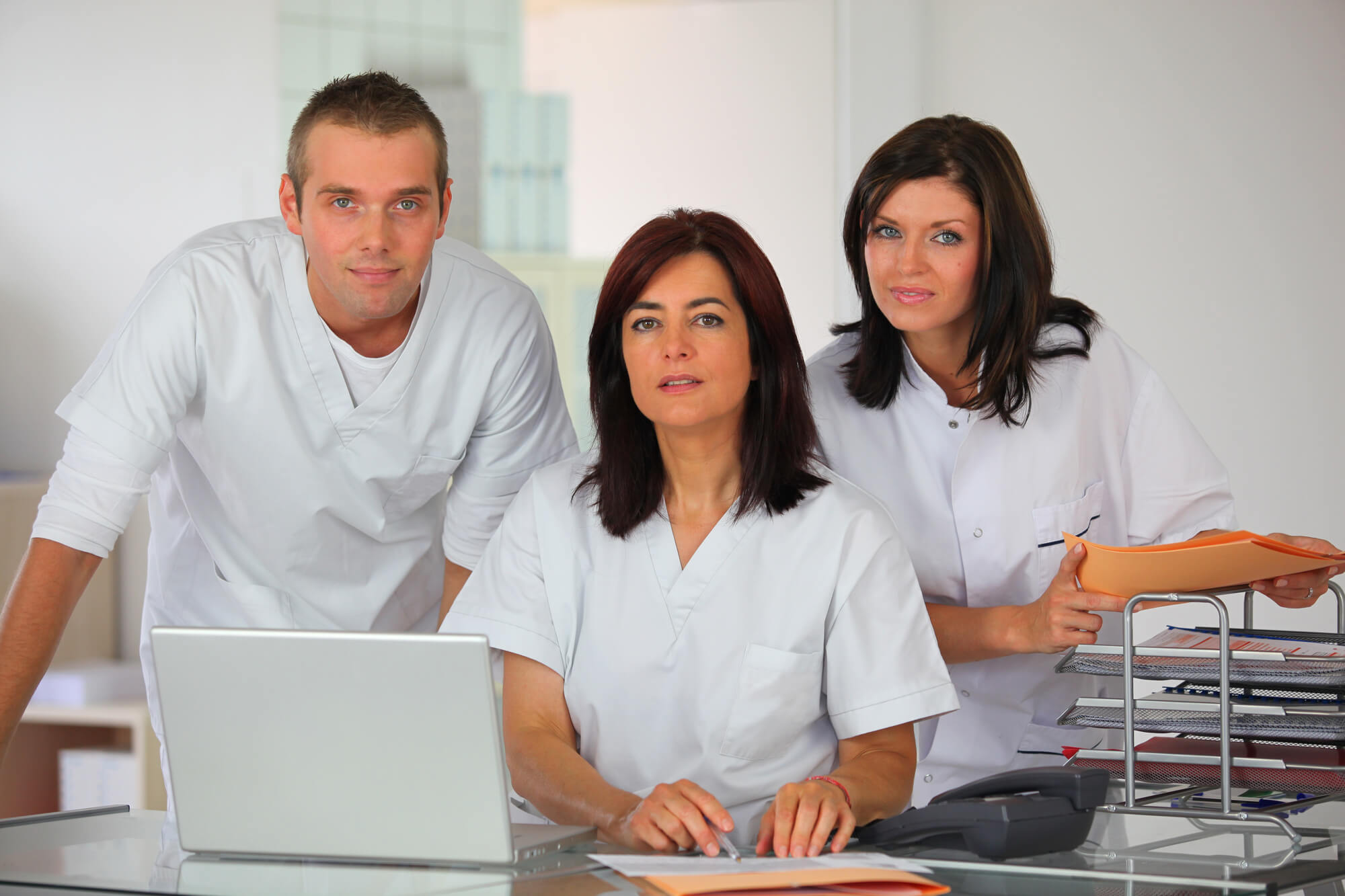 Dental staff taking a photo.