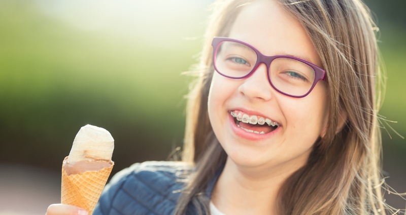 girl with braces eating ice cream