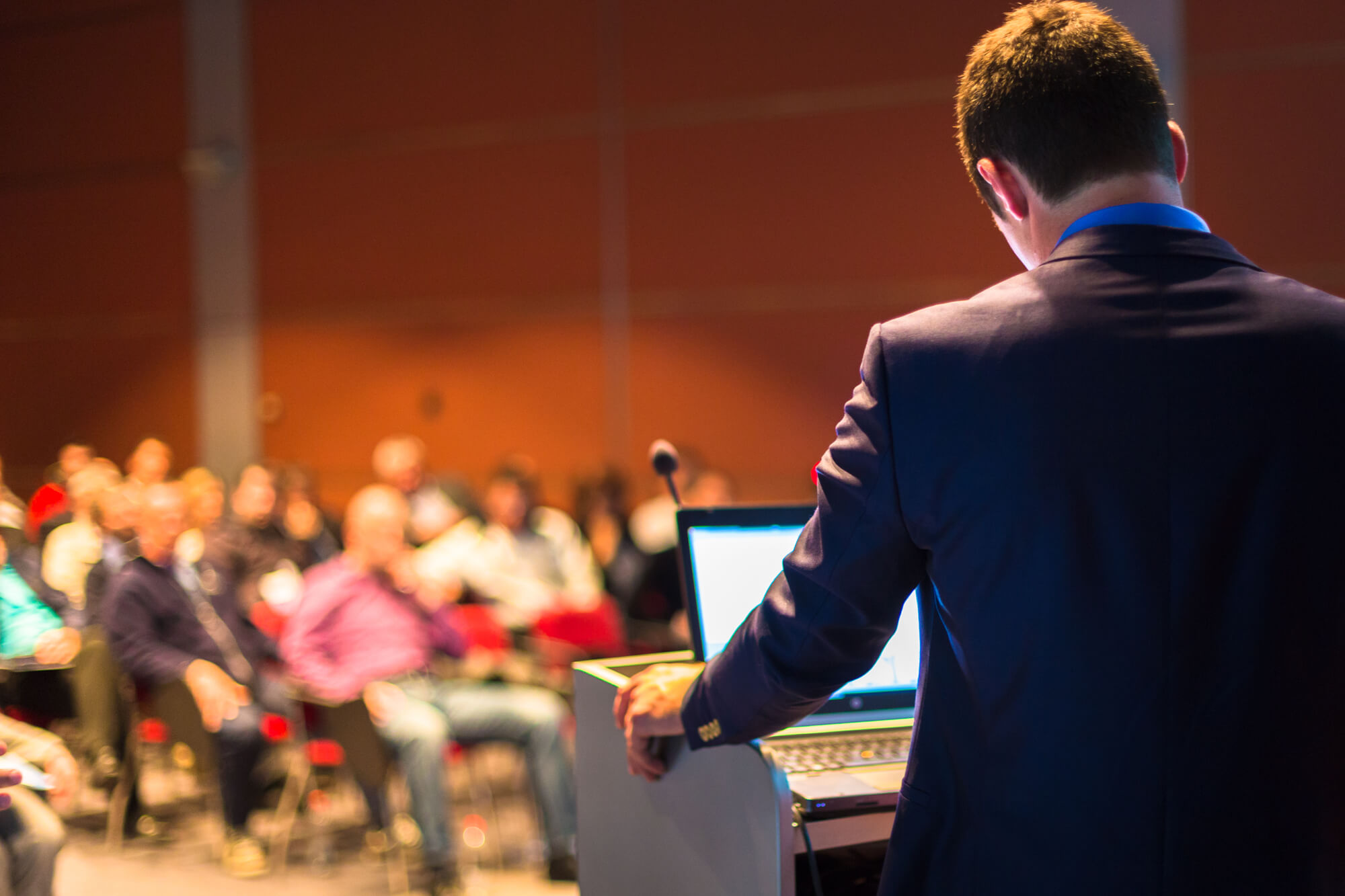 businessman speaking at a conference