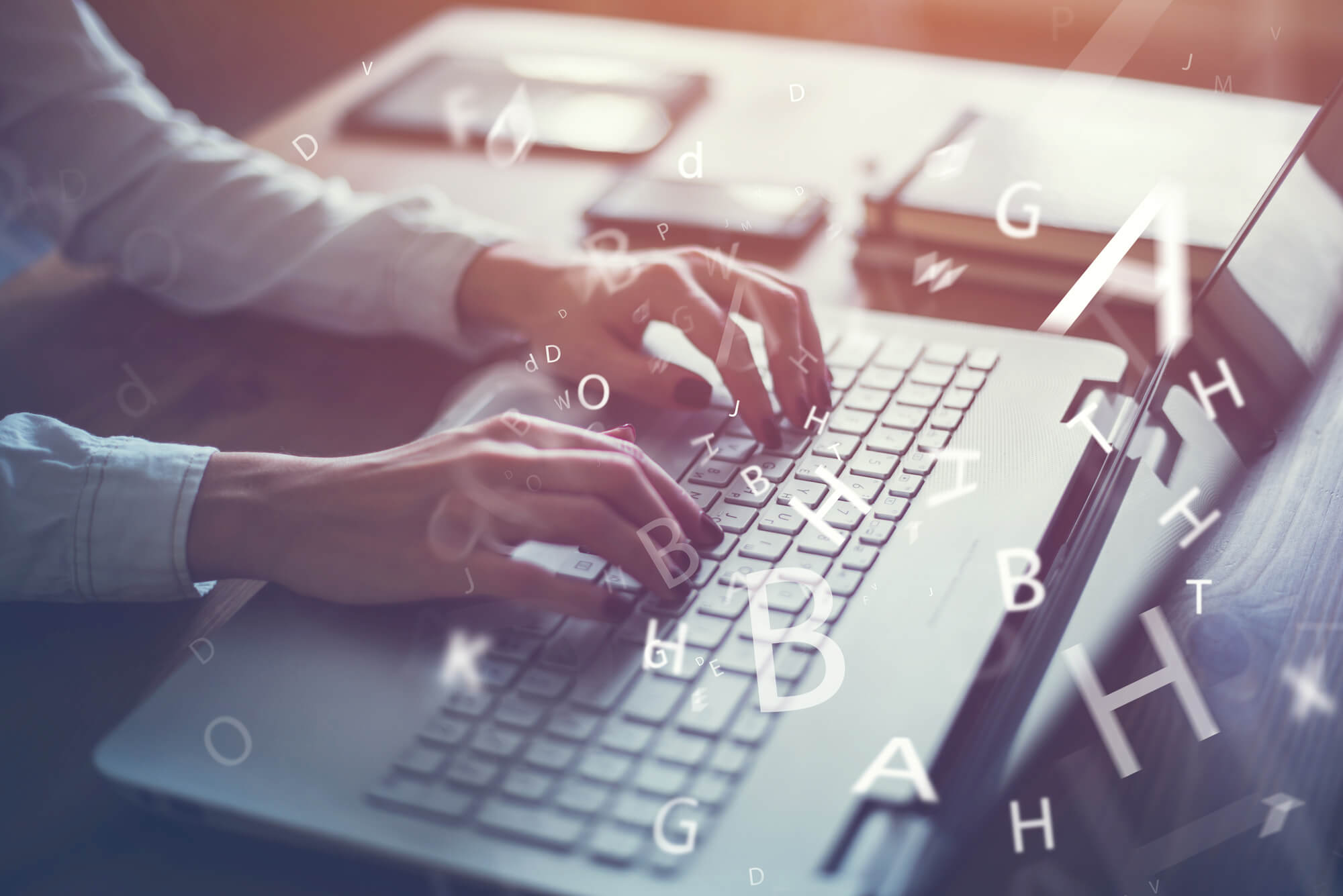 ghostwriter typing on his laptop