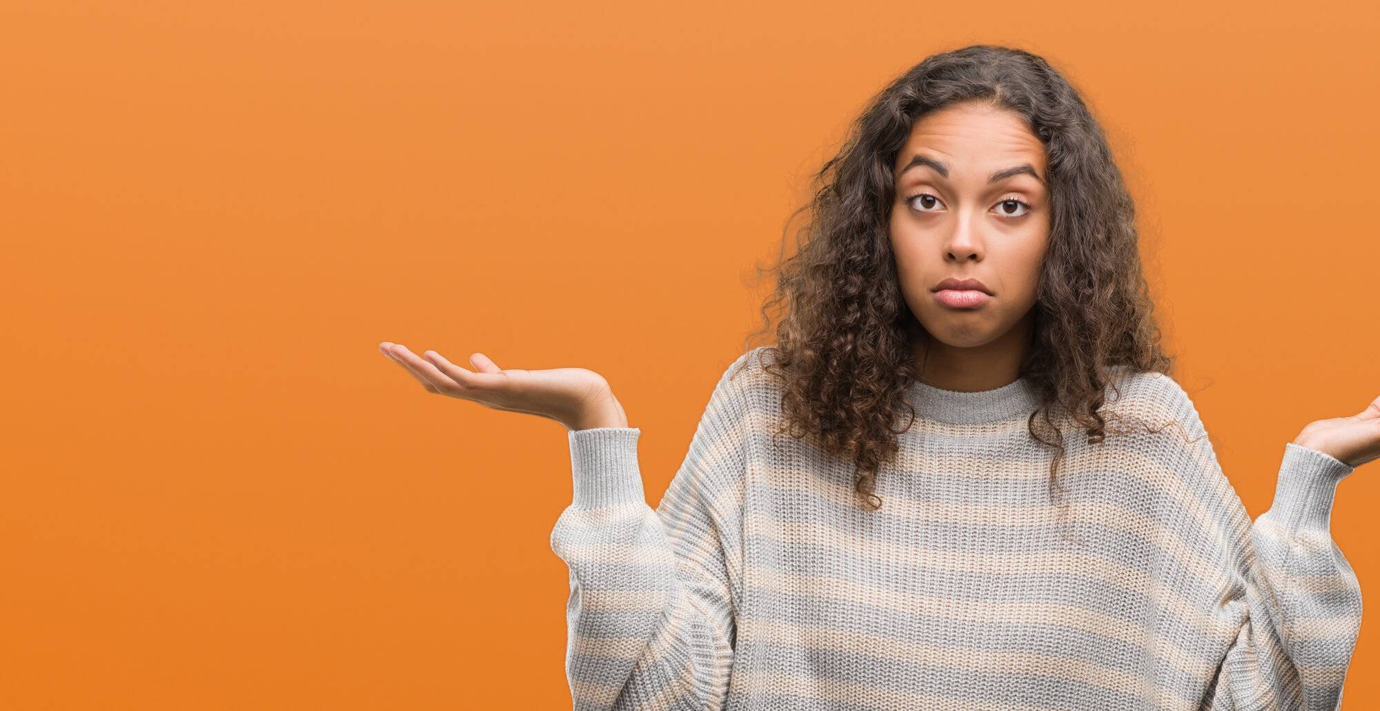 hispanic woman shrugging