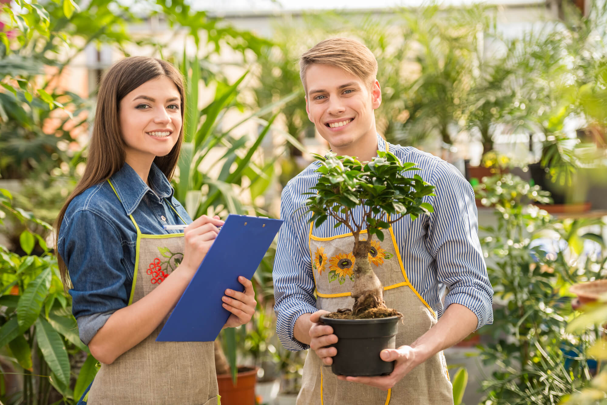 landscapers smiling at camera for a social media post.