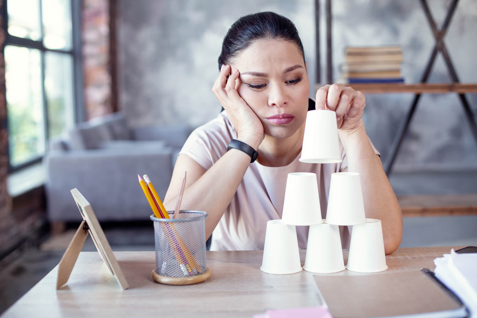 woman stacking cups in the office