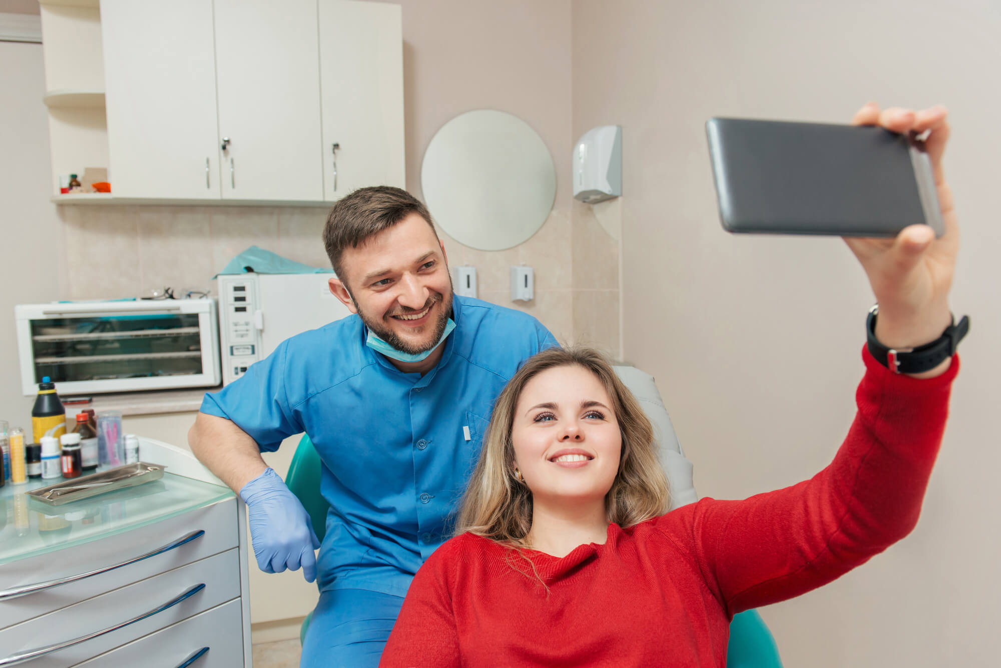 patient taking a selfie with dentist