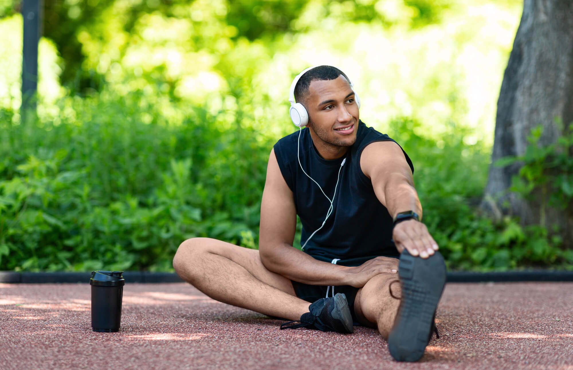 man listening to podcast while exercising